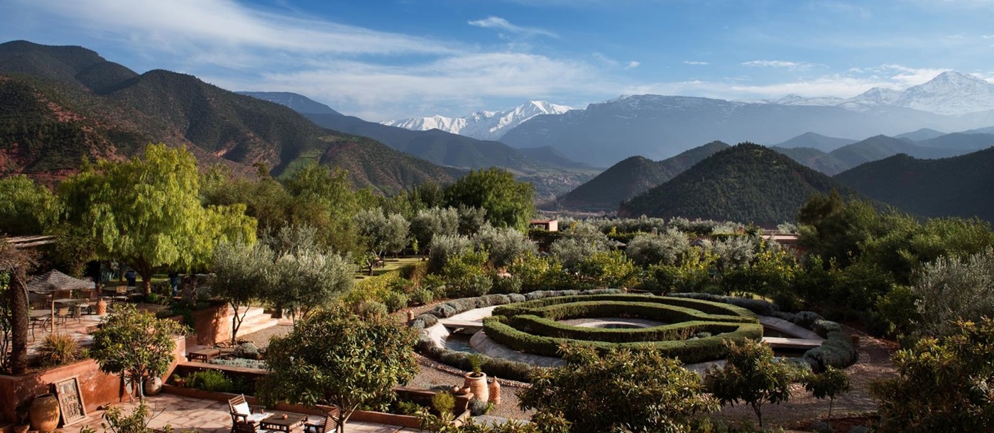 Manicured gardens at Kasbah Bab Ourika with views over the Atlas Mountains