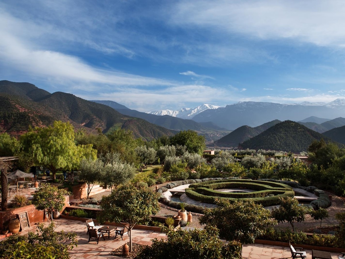 Manicured gardens at Kasbah Bab Ourika with views over the Atlas Mountains