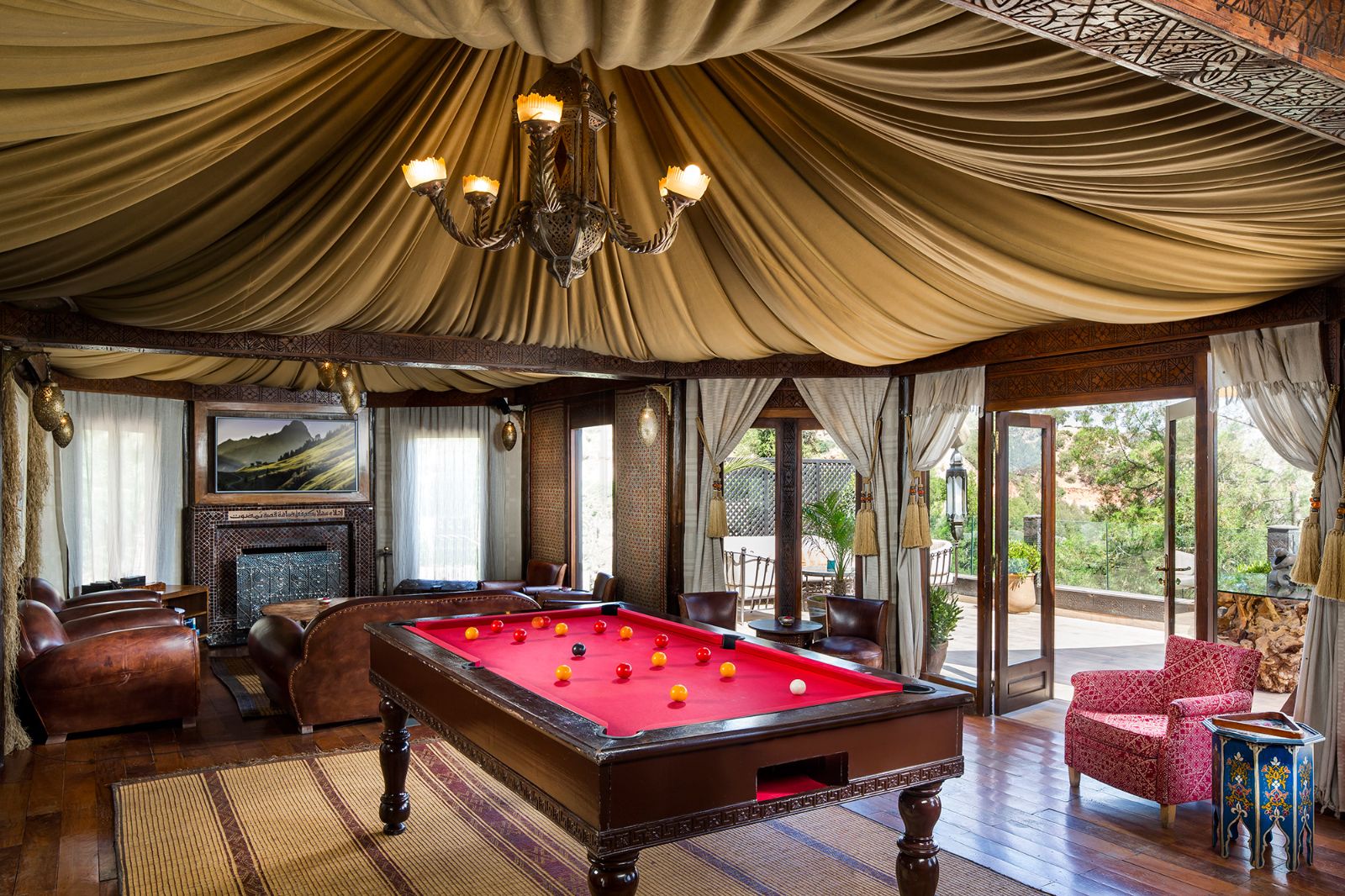 Asmoun lounge chairs and pool table at Kasbah Tamadot in the Atlas Mountains of Morocco