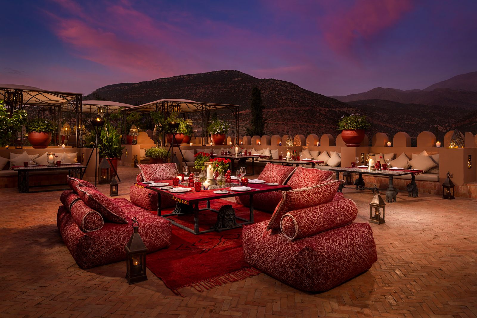 Roof dining terrace at sunset at at Kasbah Tamadot in the Atlas Mountains of Morocco