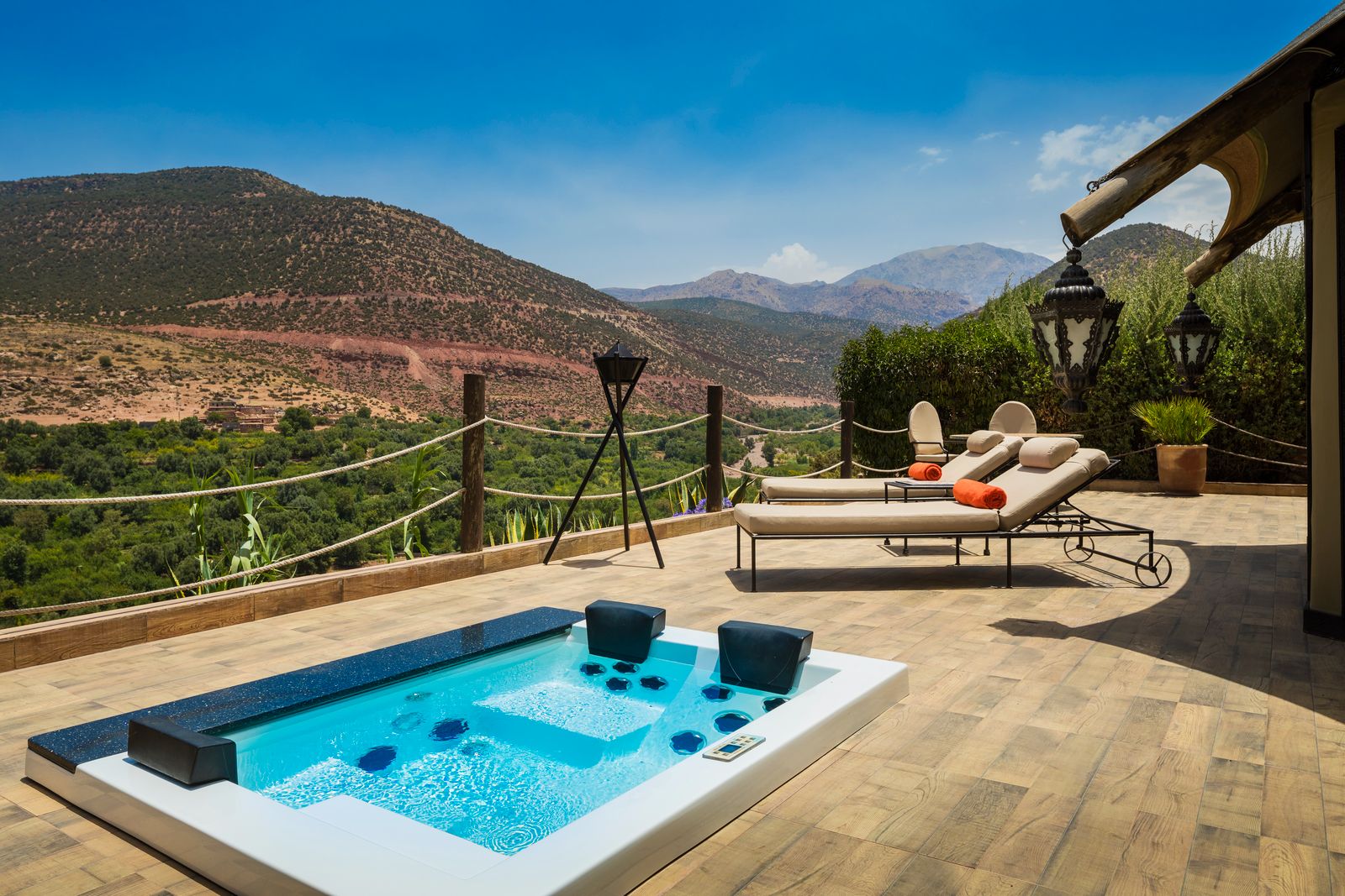 Private terrace with pool and loungers at Kasbah Tamadot in the Atlas Mountains of Morocco