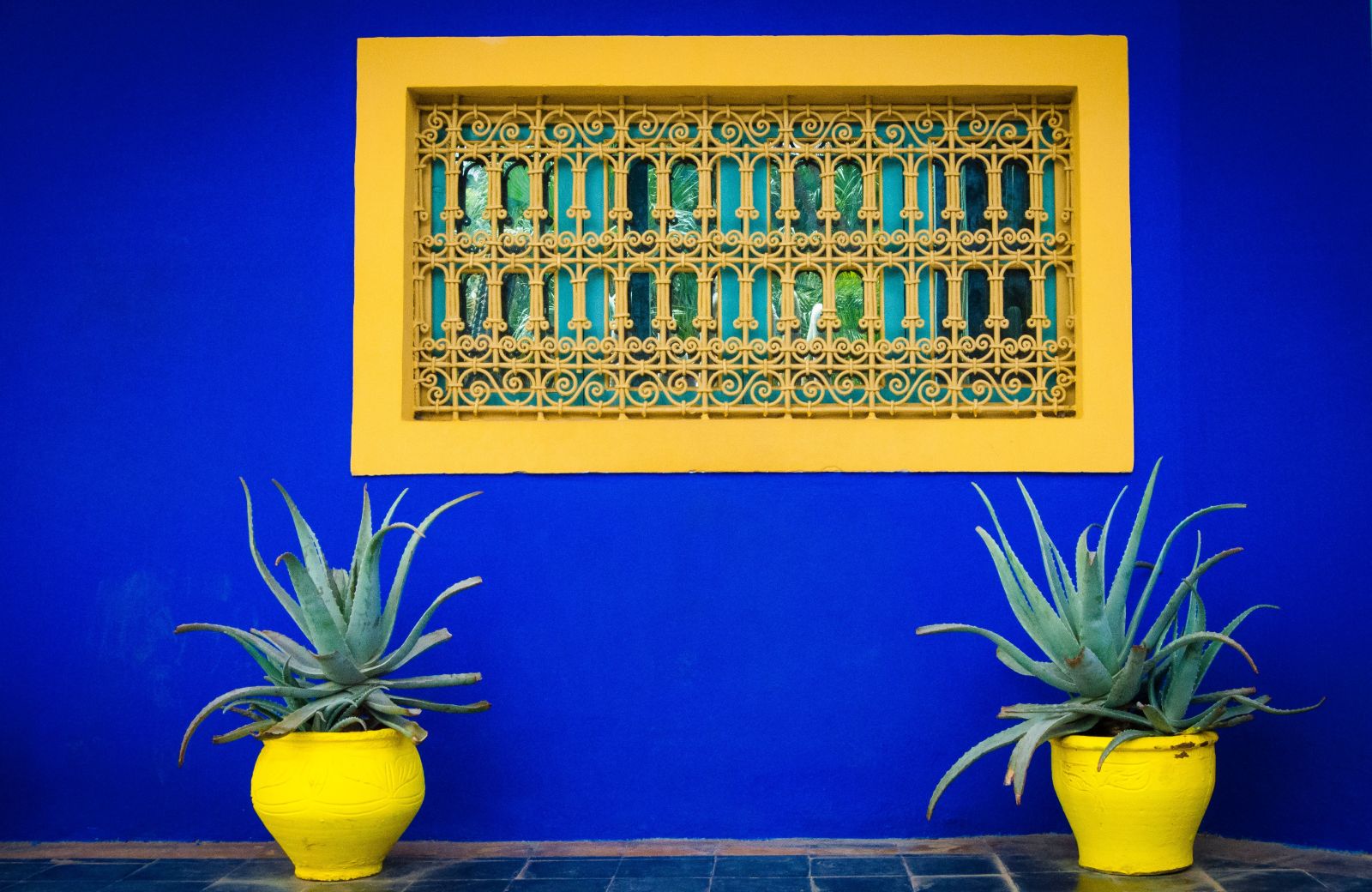 Bright blue and yellow design in the Majorelle Gardens Marrakech Morocco