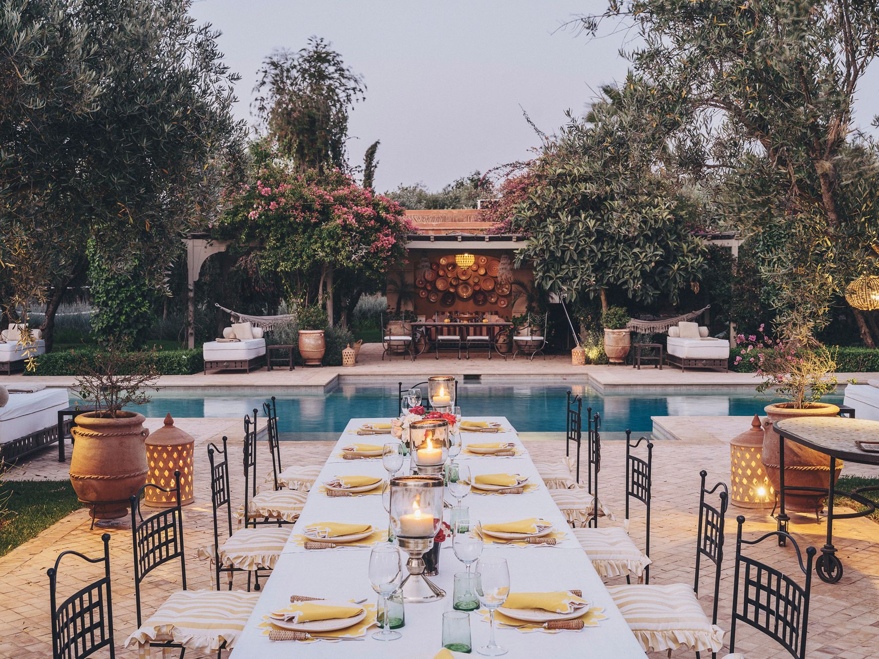 Outdoor dining and pool at Dar Arbala