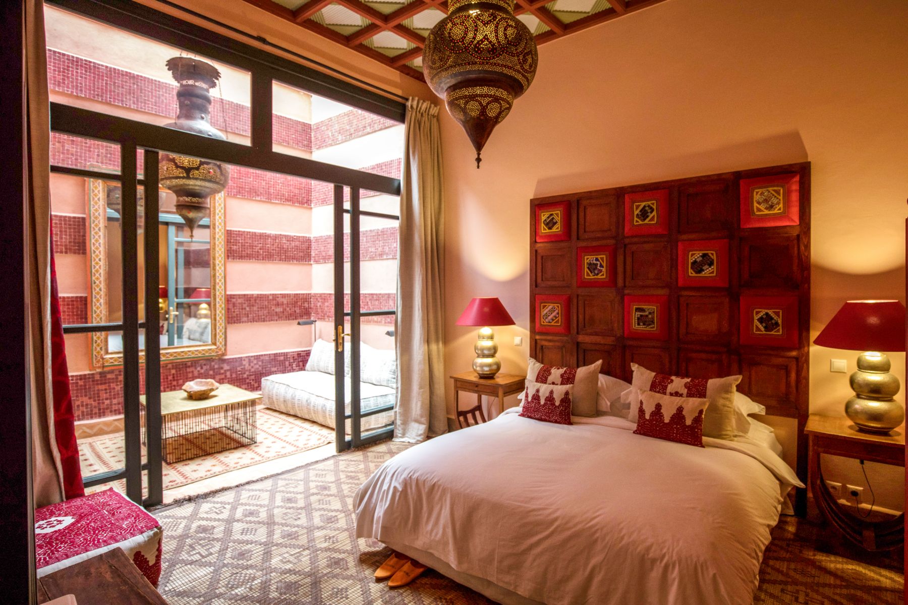Red bedroom at Villa Alkhozama in Morocco