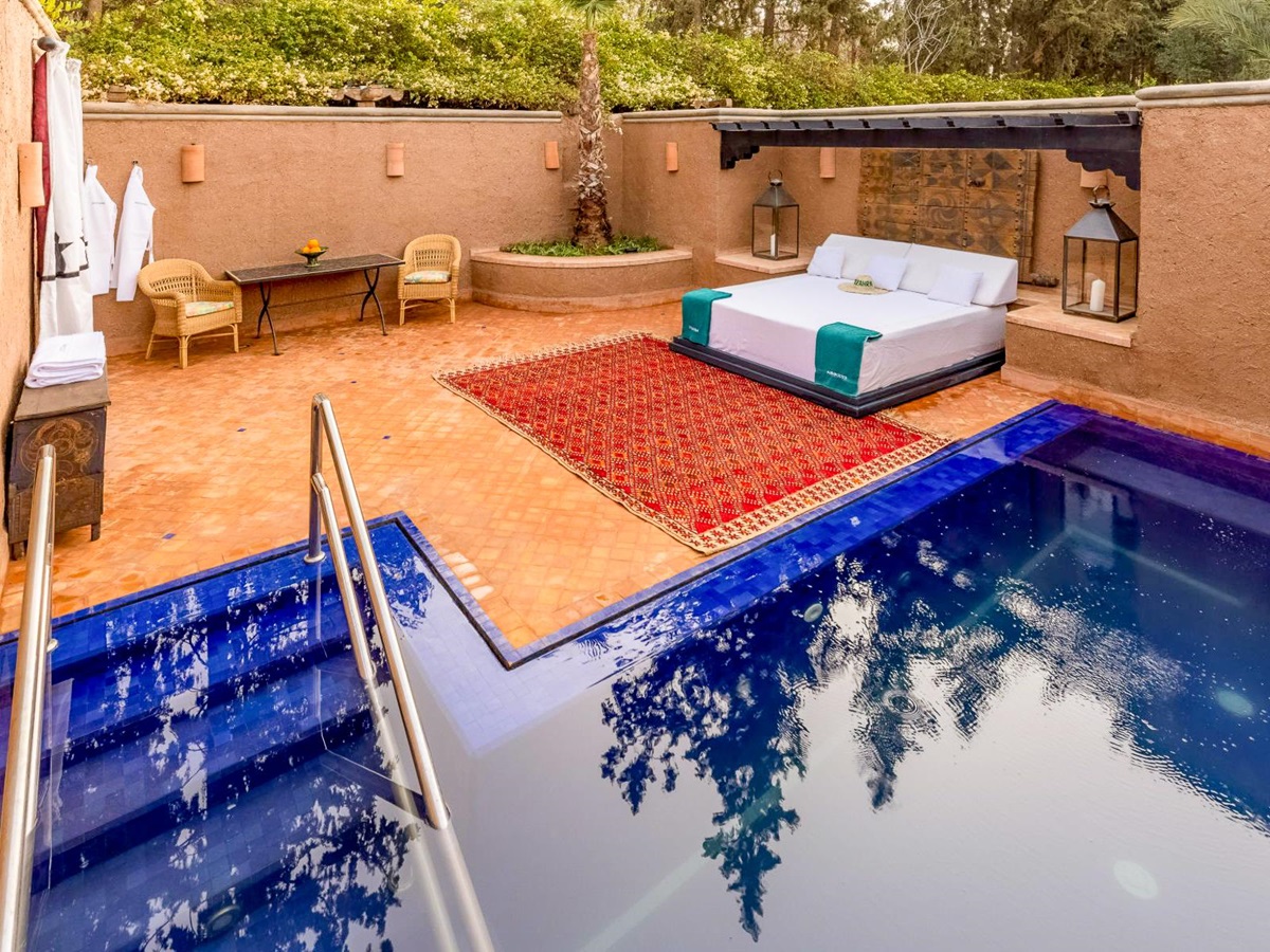 Pool and large sun lounger at Villa Azeer in Morocco