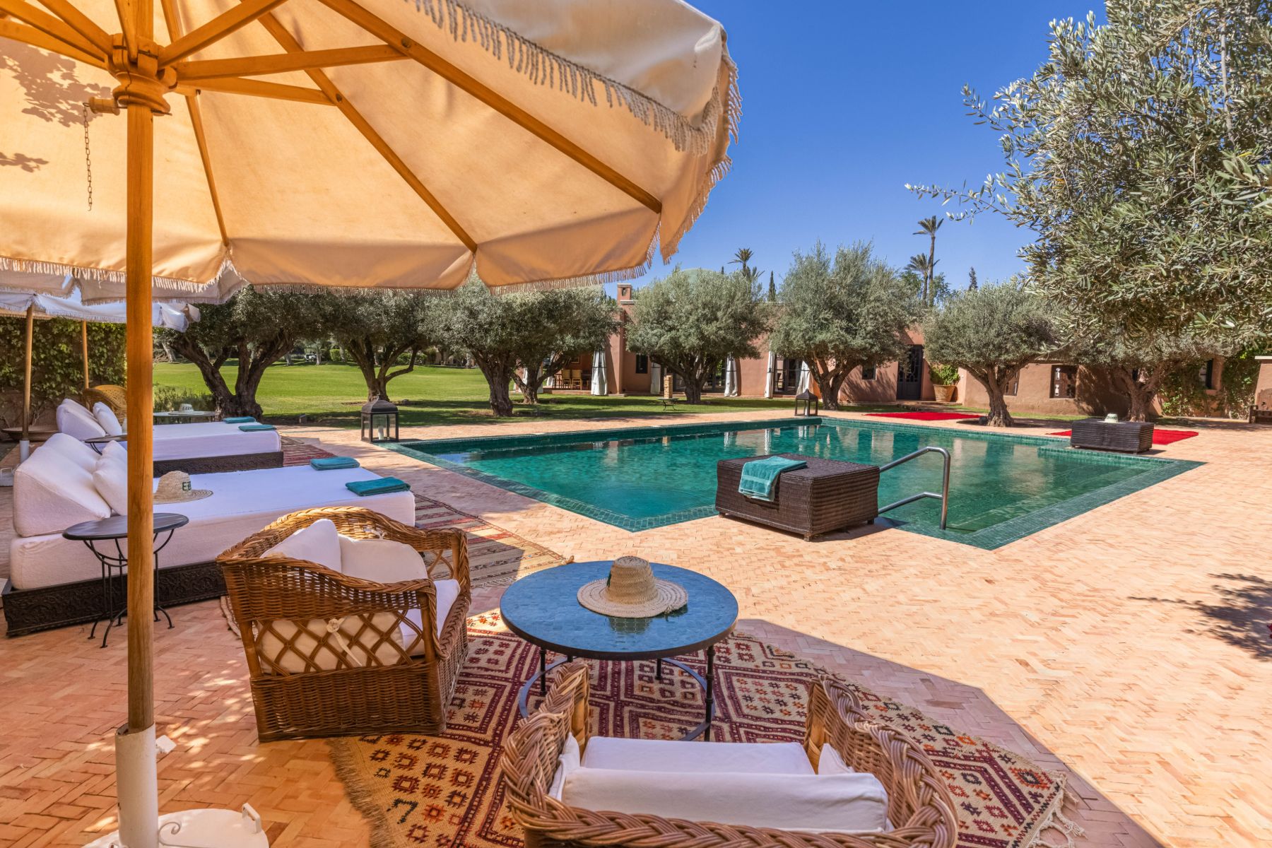 Pool and umbrella at Villa Azzaytouna in Morocco