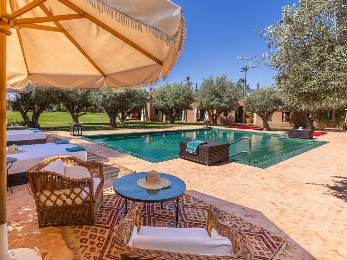 Pool and umbrella at Villa Azzaytouna in Morocco