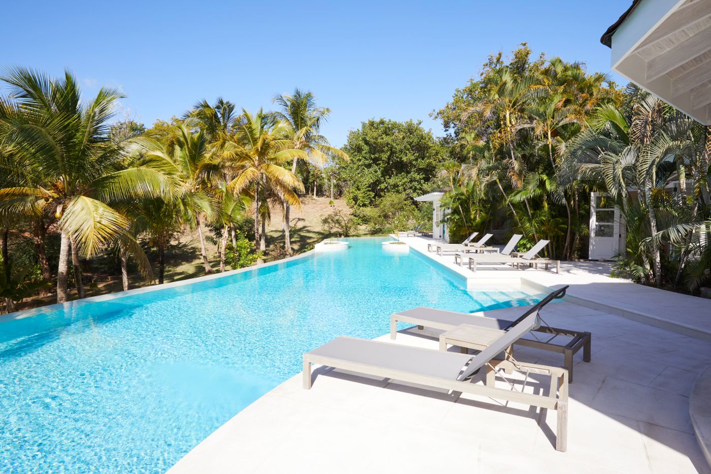 View of the pool area and gardens at Bamboo House