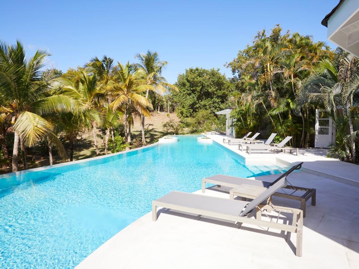 View of the pool area and gardens at Bamboo House
