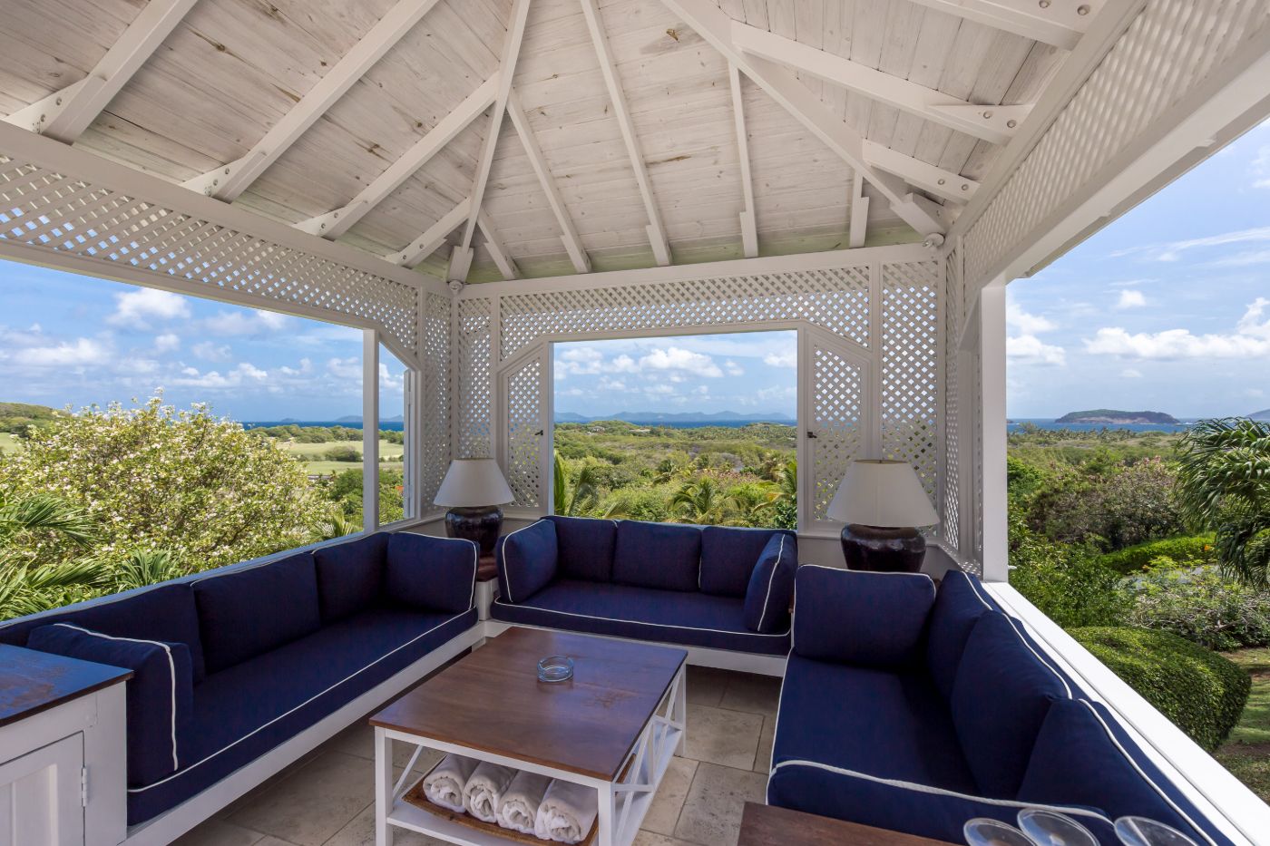 Comfortable covered outdoor seating area at Callaloo with panoramic views