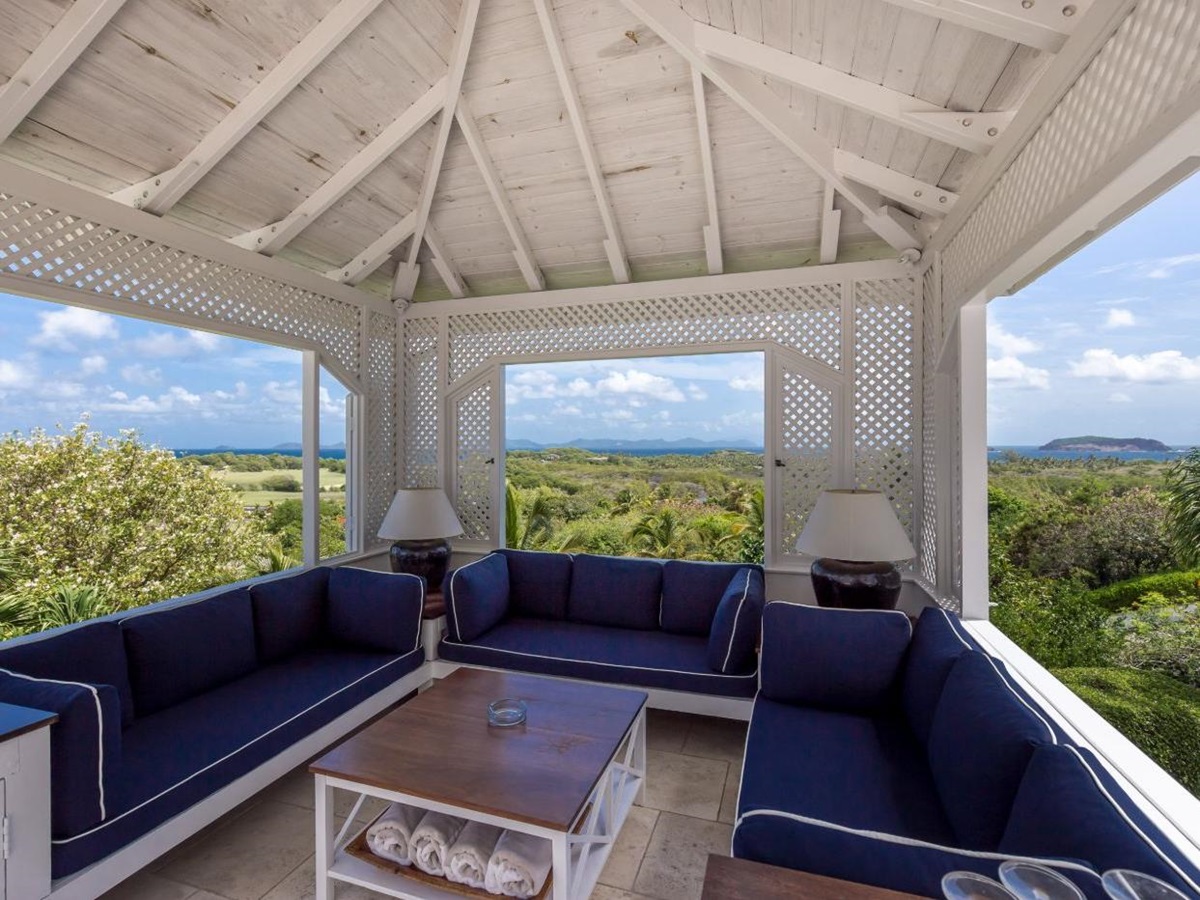 Comfortable covered outdoor seating area at Callaloo with panoramic views