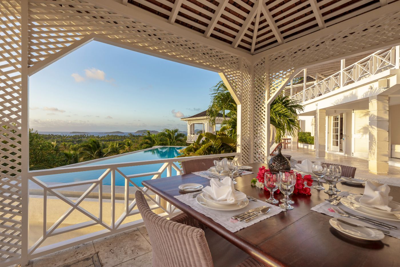 Terrace with dining area and pool views at Callaloo