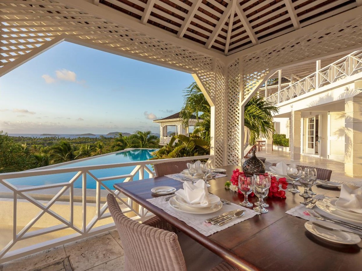 Terrace with dining area and pool views at Callaloo