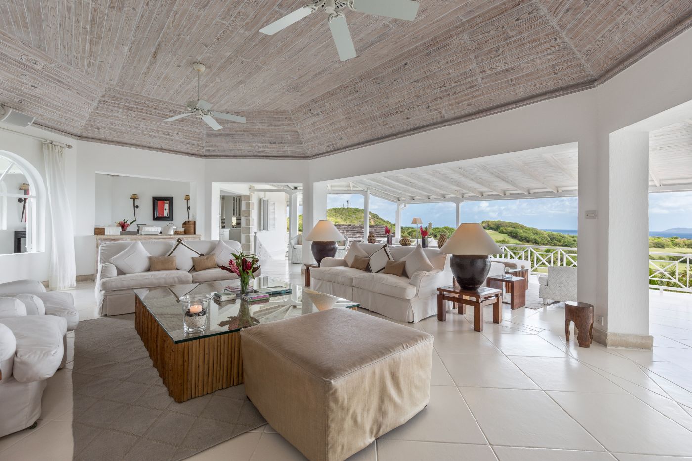 Living room with panoramic garden views at Callaloo