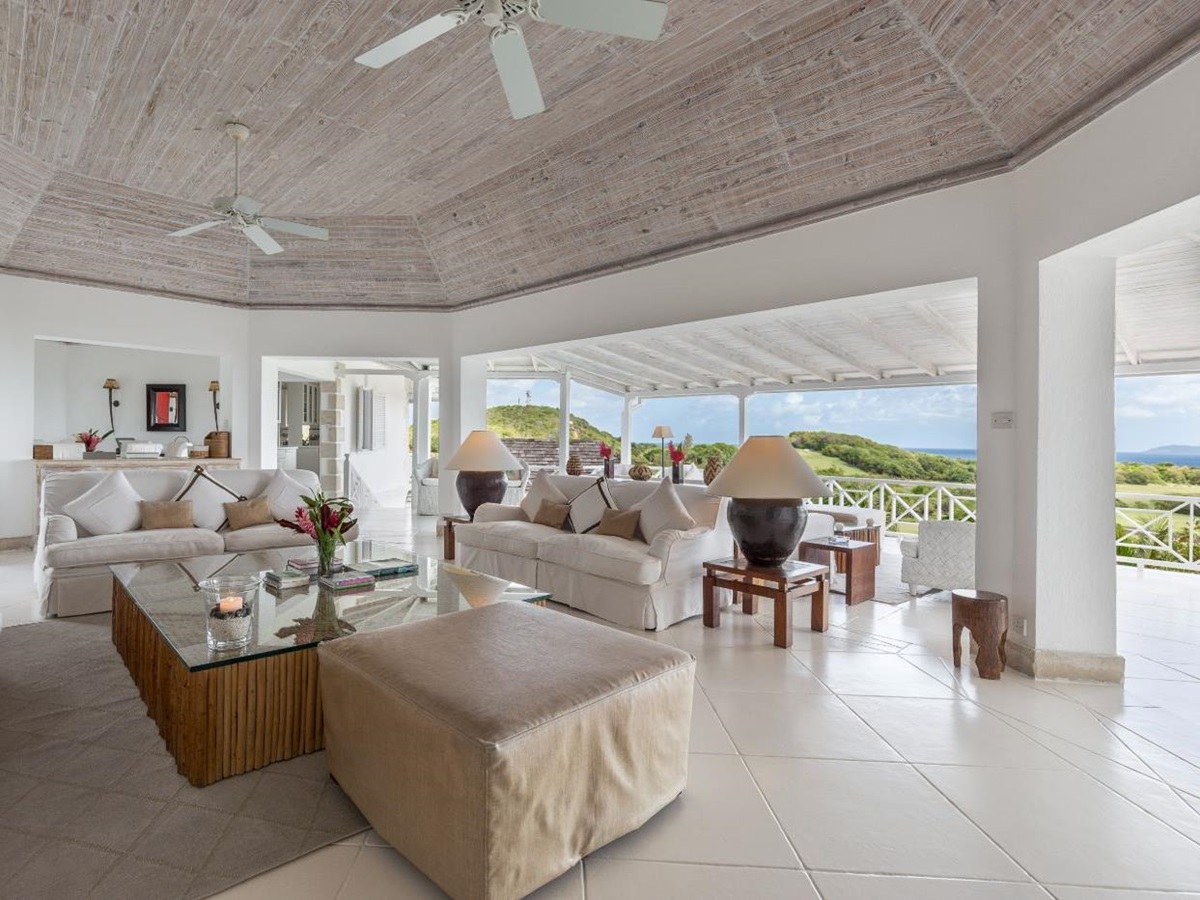 Living room with panoramic garden views at Callaloo