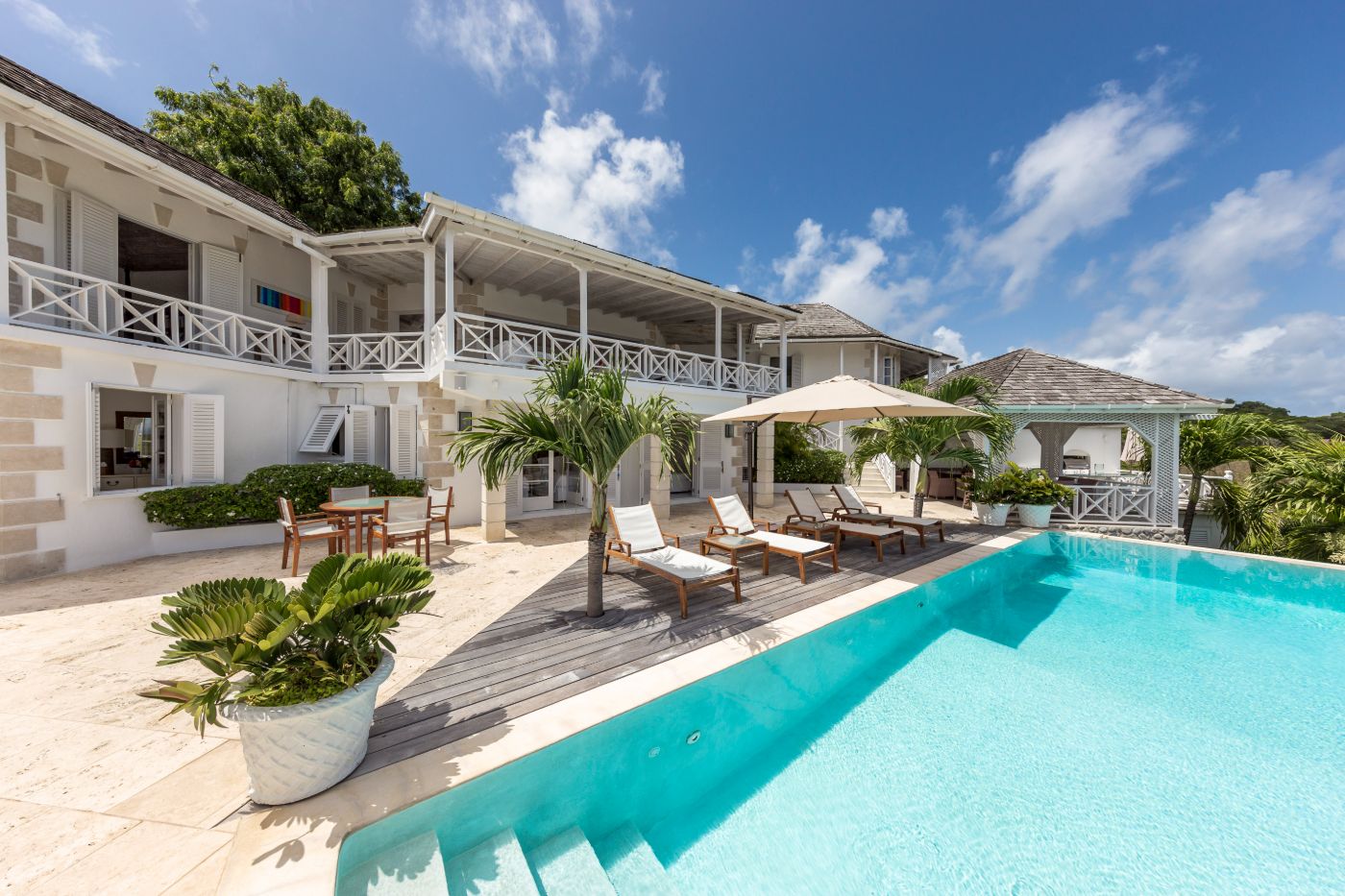 Pool area with loungers at Callaloo