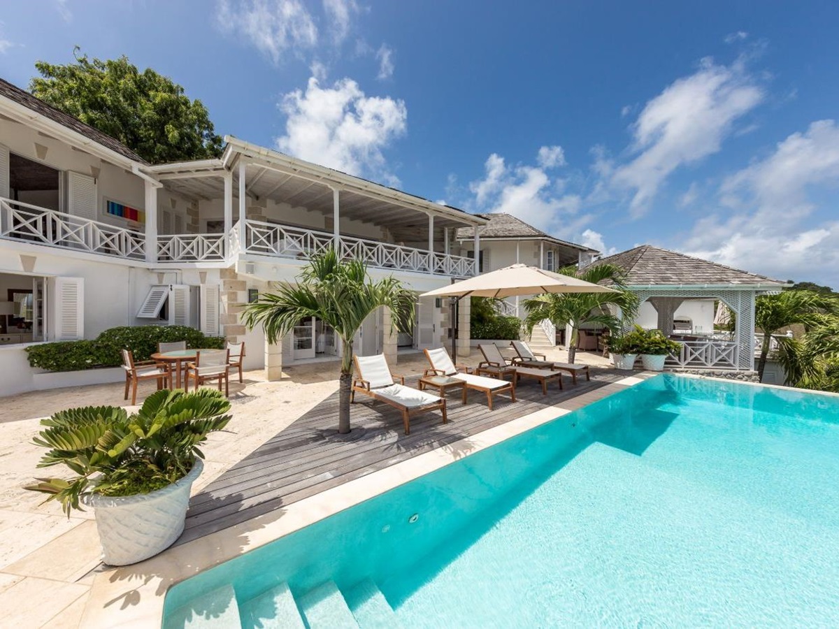 Pool area with loungers at Callaloo