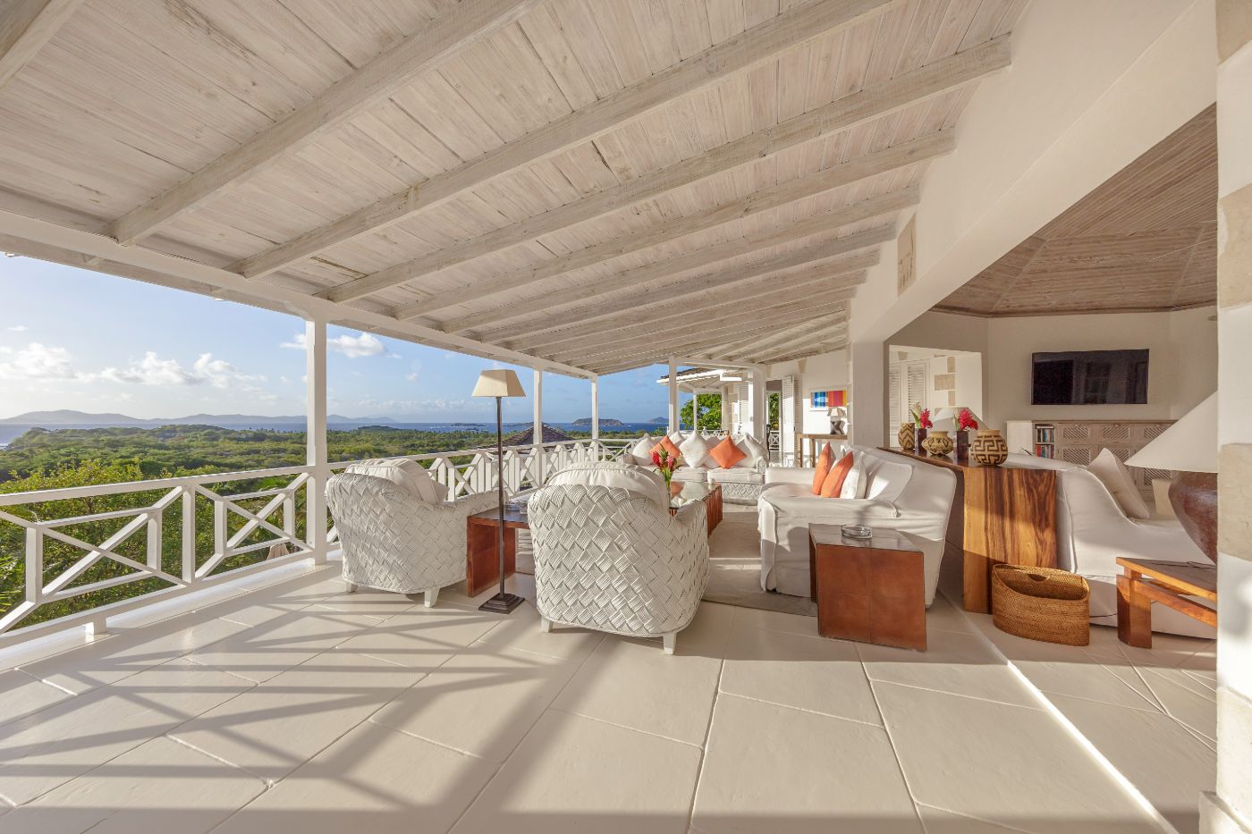 Covered terrace with seating area and panoramic views at Callaloo