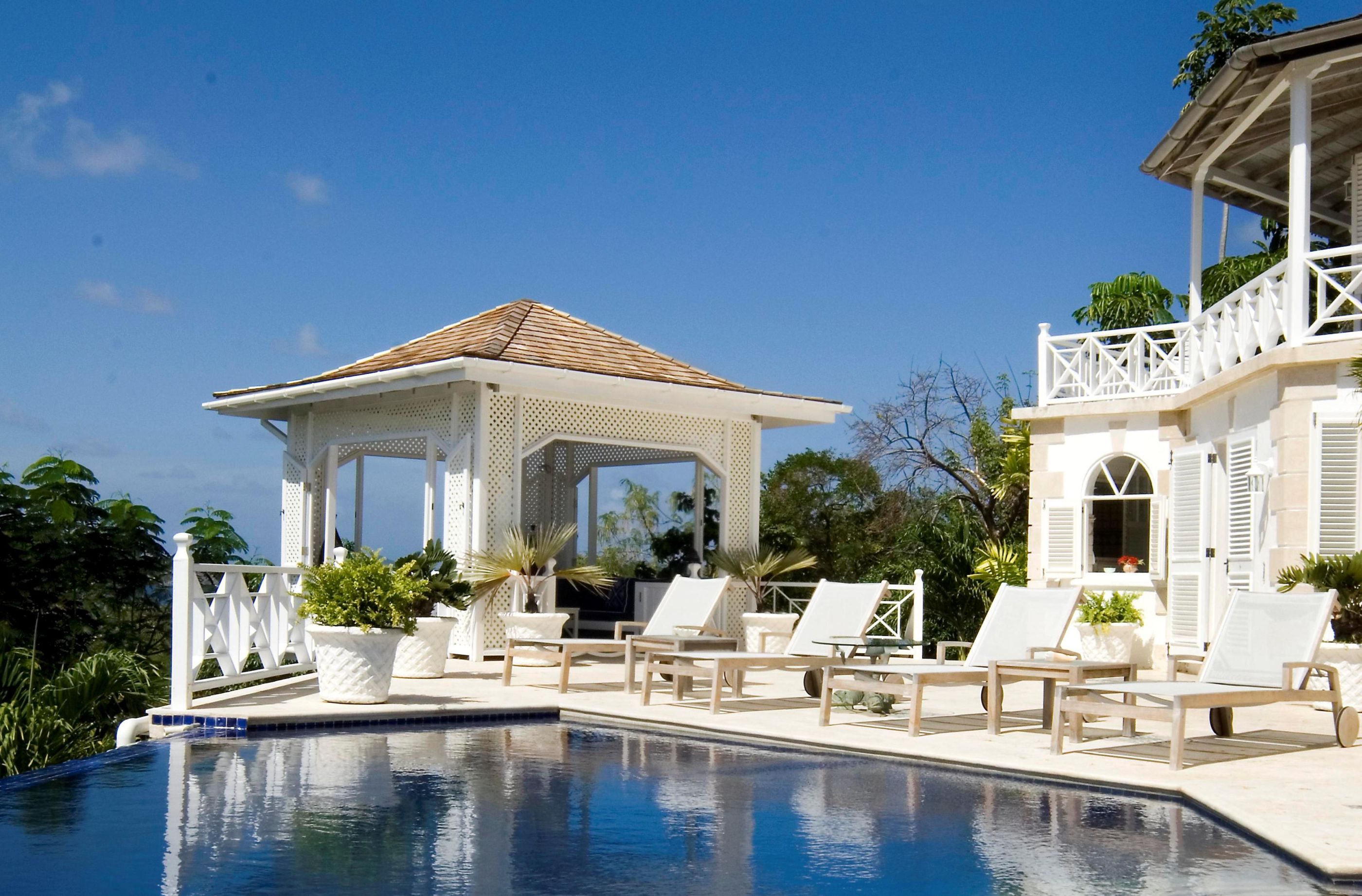 wimming pool and pool house with sun loungers at Callaloo, Mustique