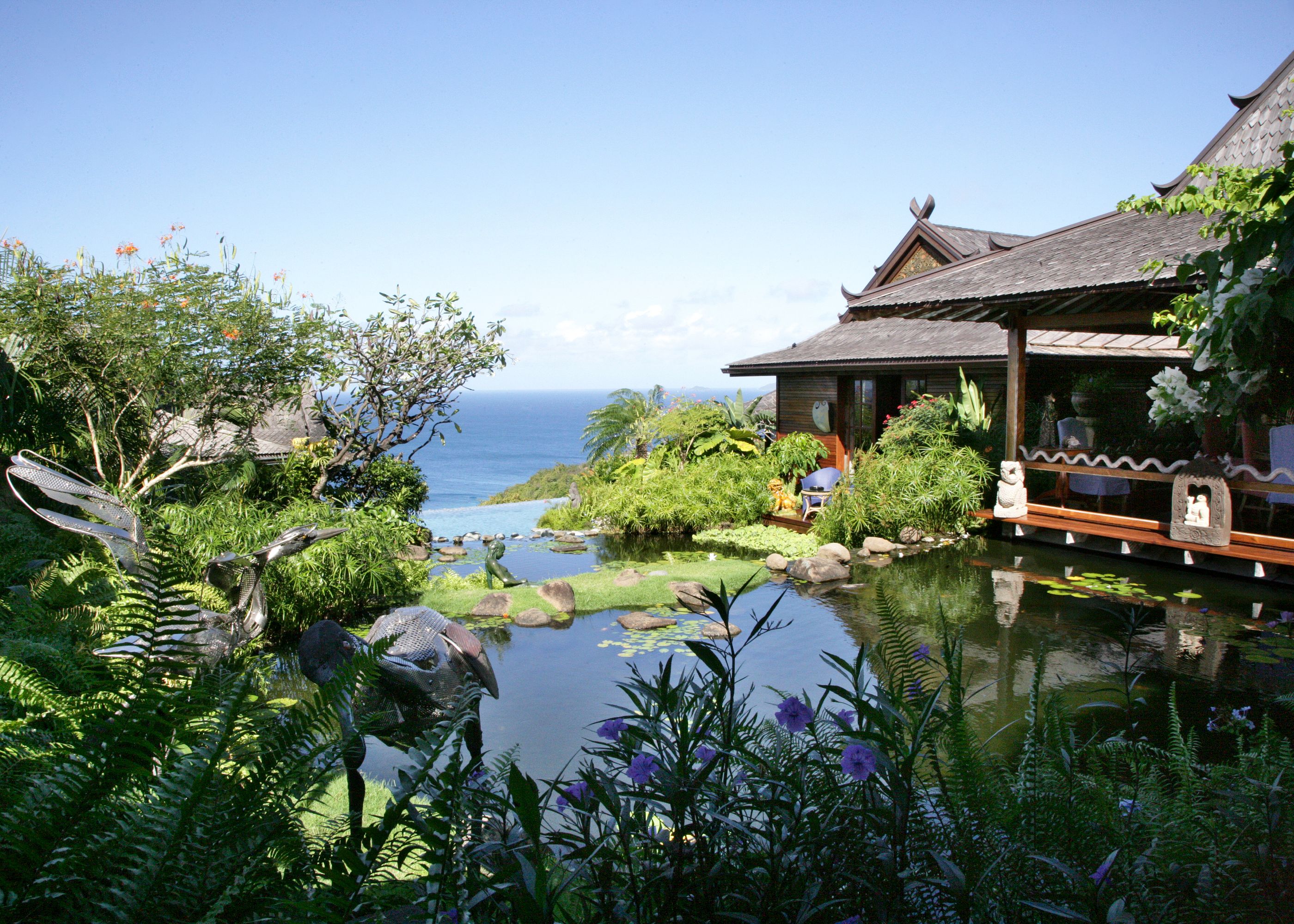 The pond and facade of Ilanga, Mustique
