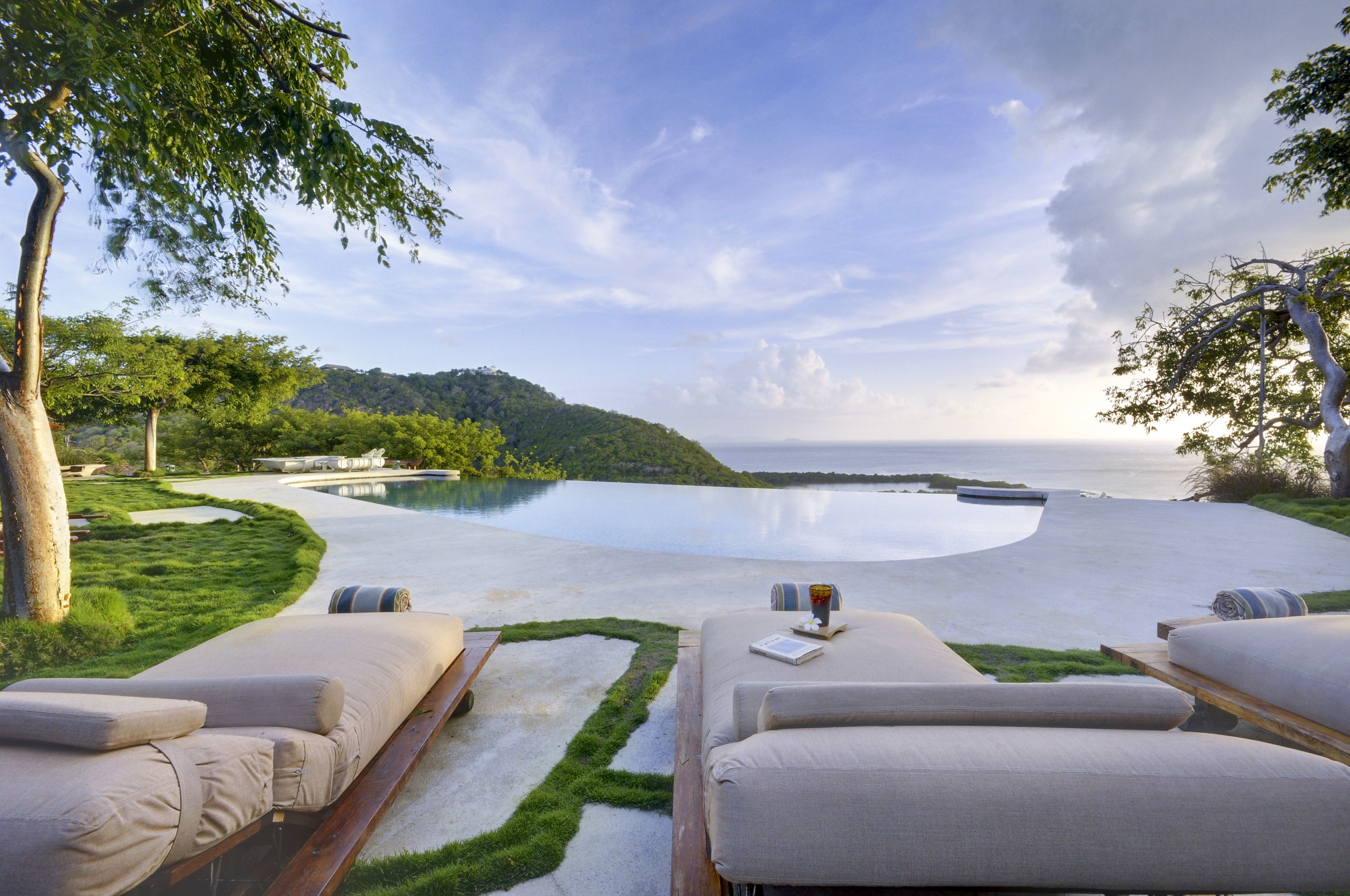 Swimming pool and outdoor beds at Opium, Mustique