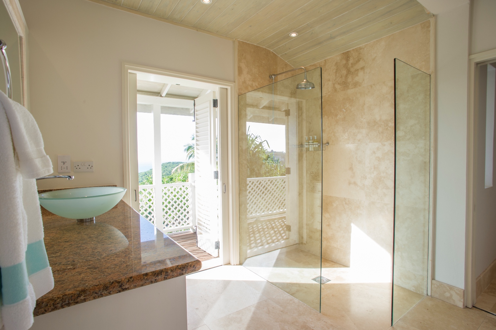 A bathroom with walk-in shower at luxury villa Pangolin in Mustique