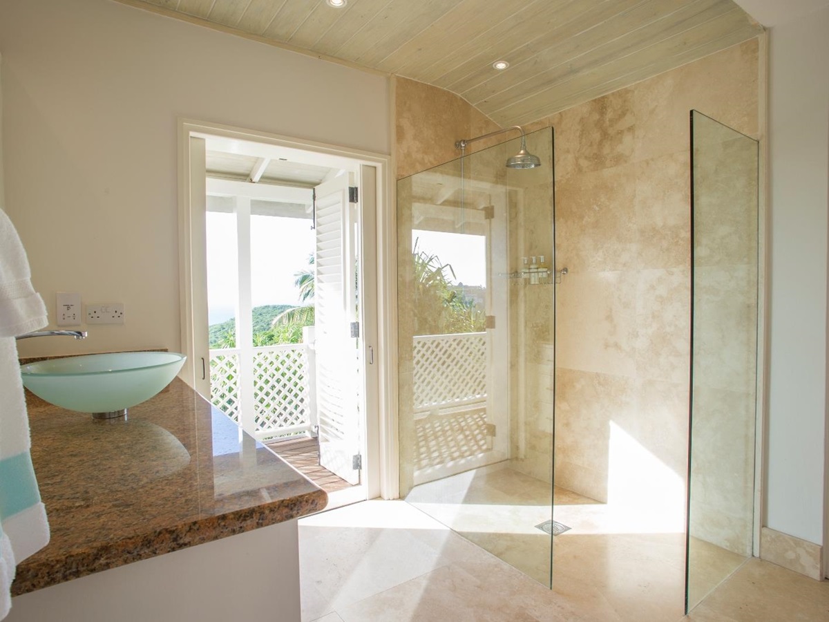 A bathroom with walk-in shower at luxury villa Pangolin in Mustique