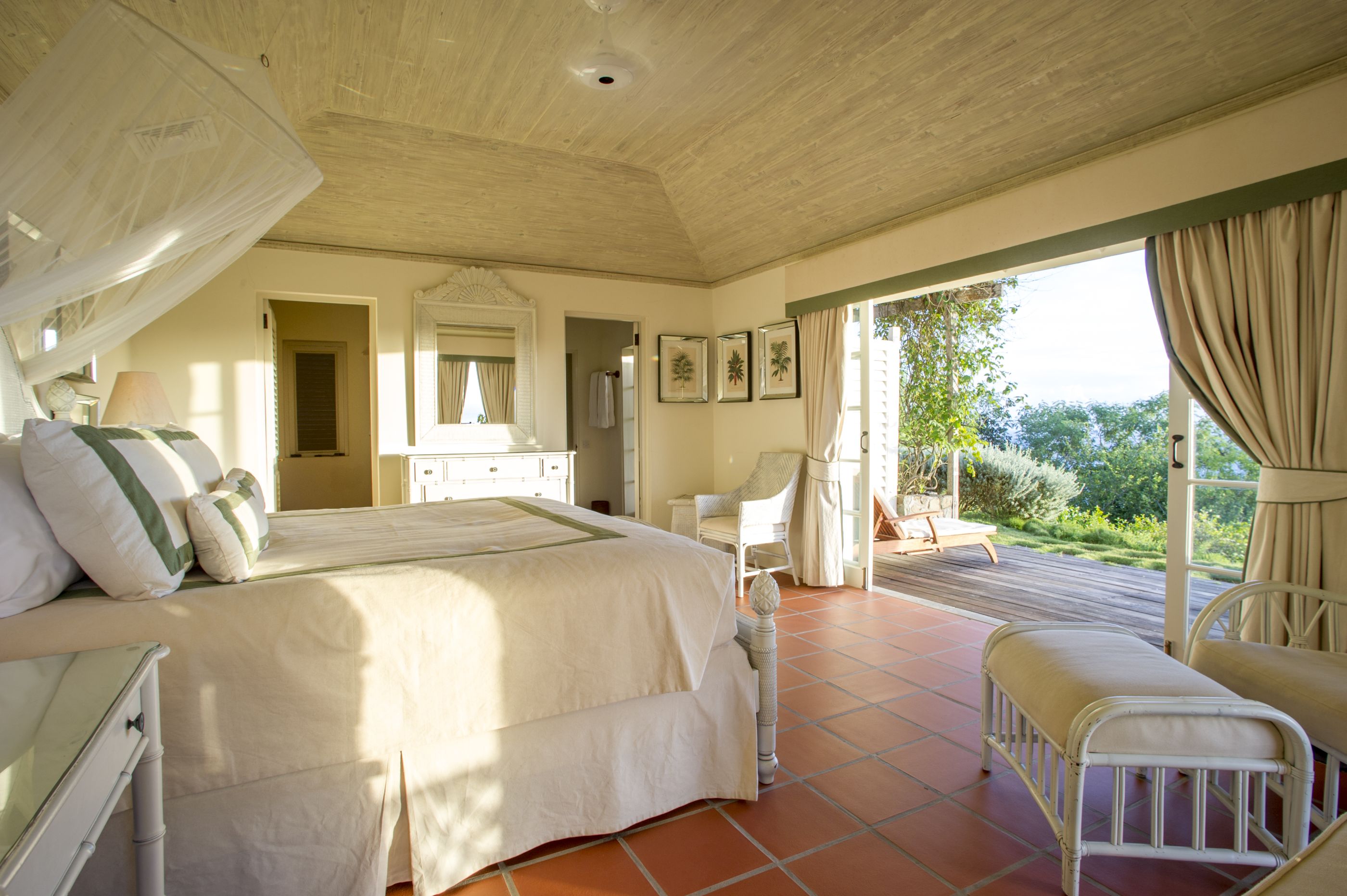 Bedroom with outdoor terrace at luxury villa Pangolin in Mustique