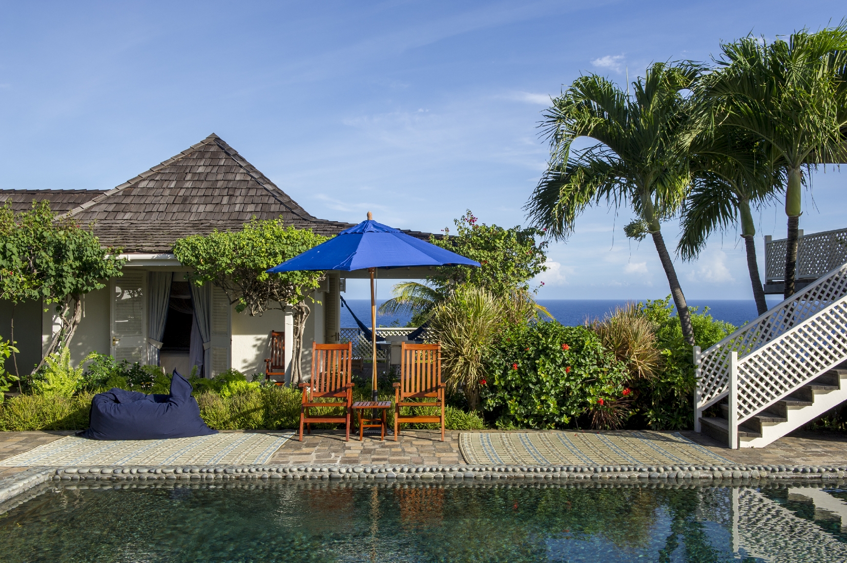 Swimming pool and facade plantation-style villa Pangolin in Mustique
