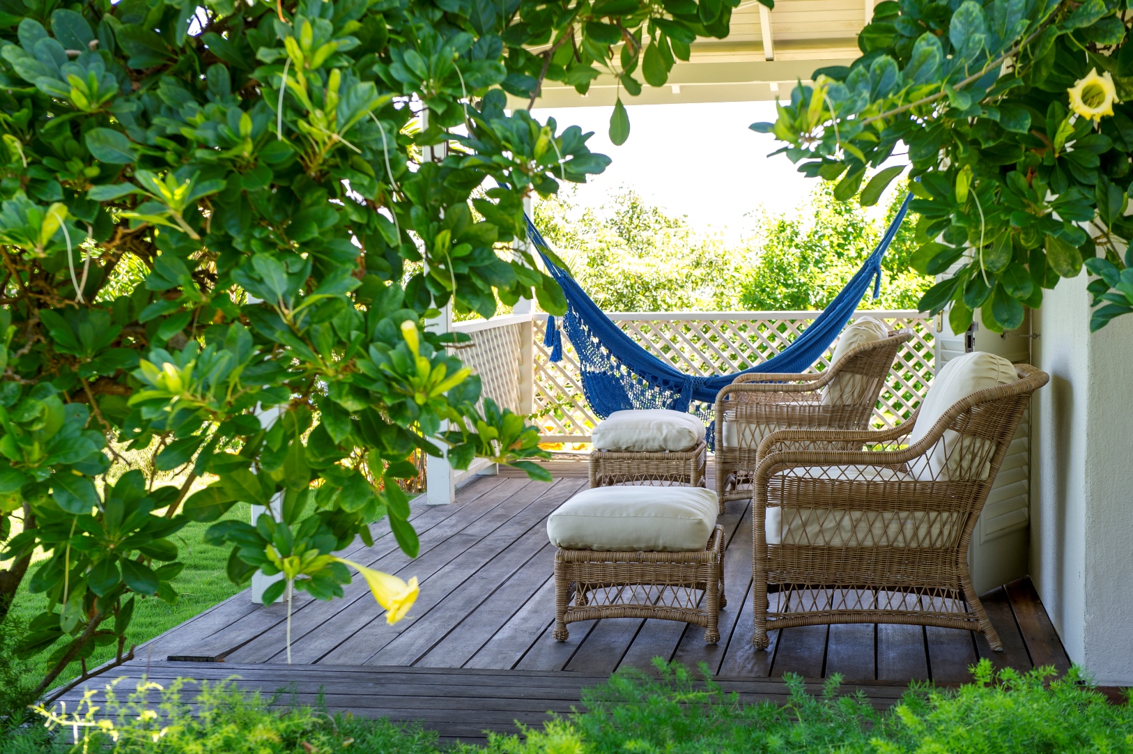 hammock and chairs on a terrace at villa Pangolin in Mustique