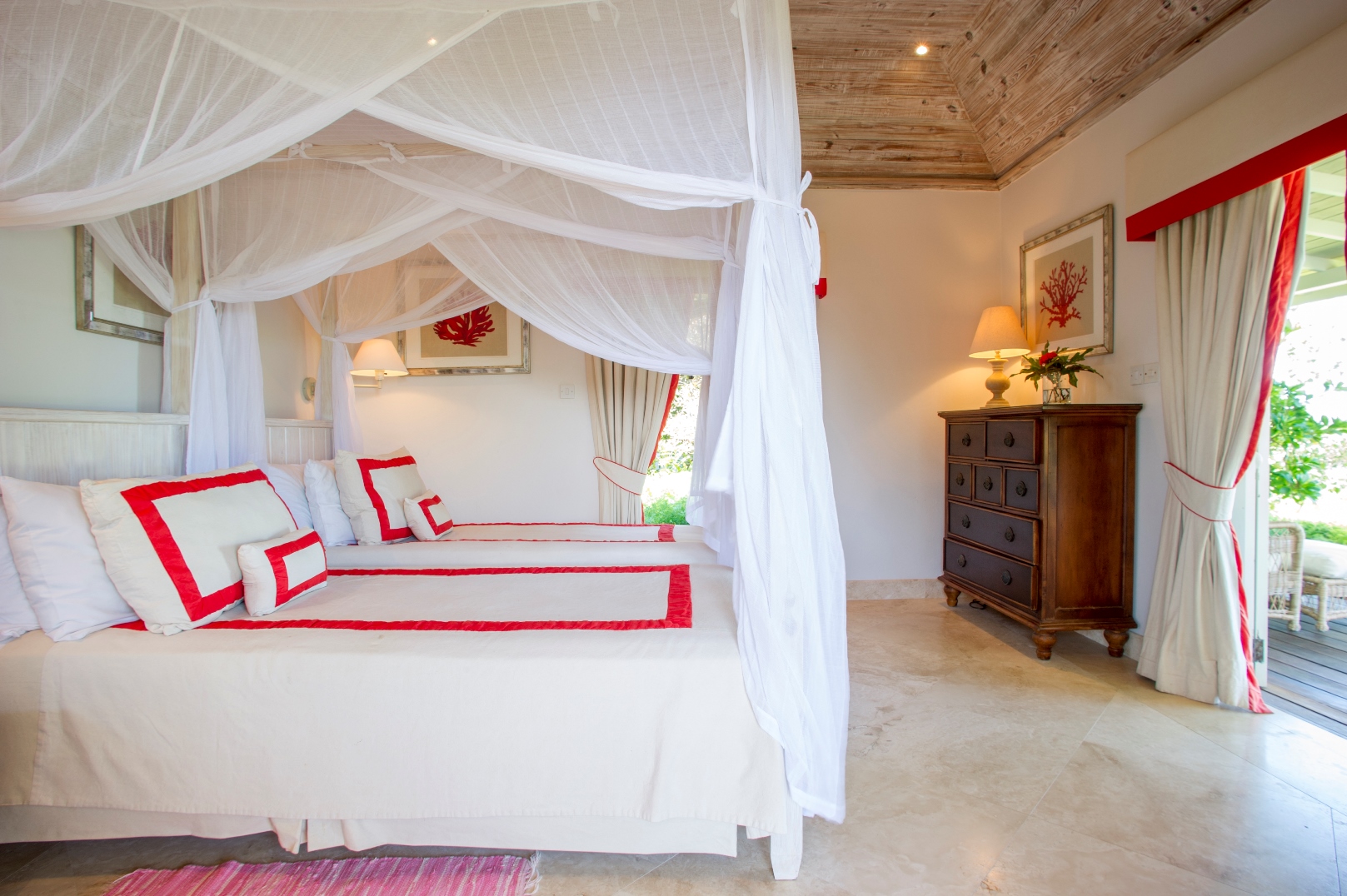 pink twin bedroom at villa Pangolin in Mustique