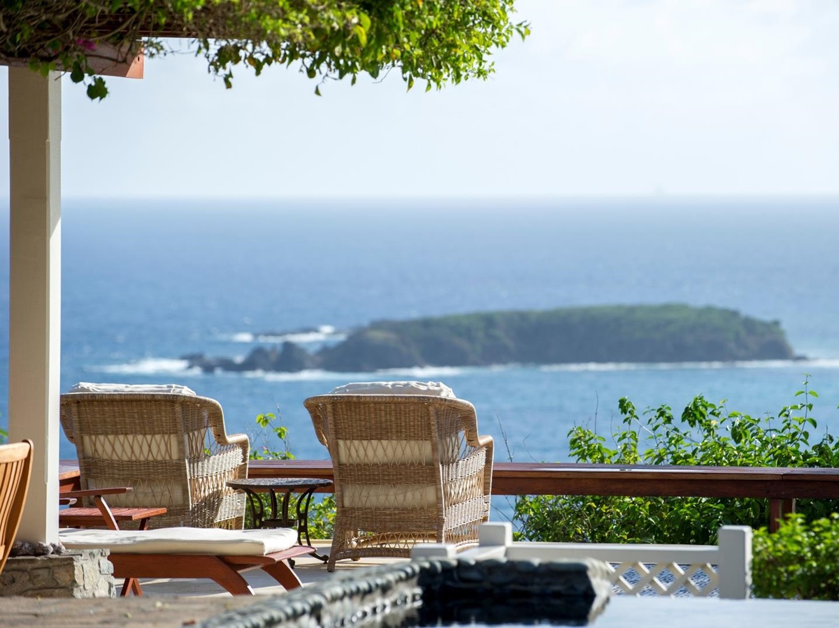 view of an island seen from the terrace at villa Pangolin in Mustique