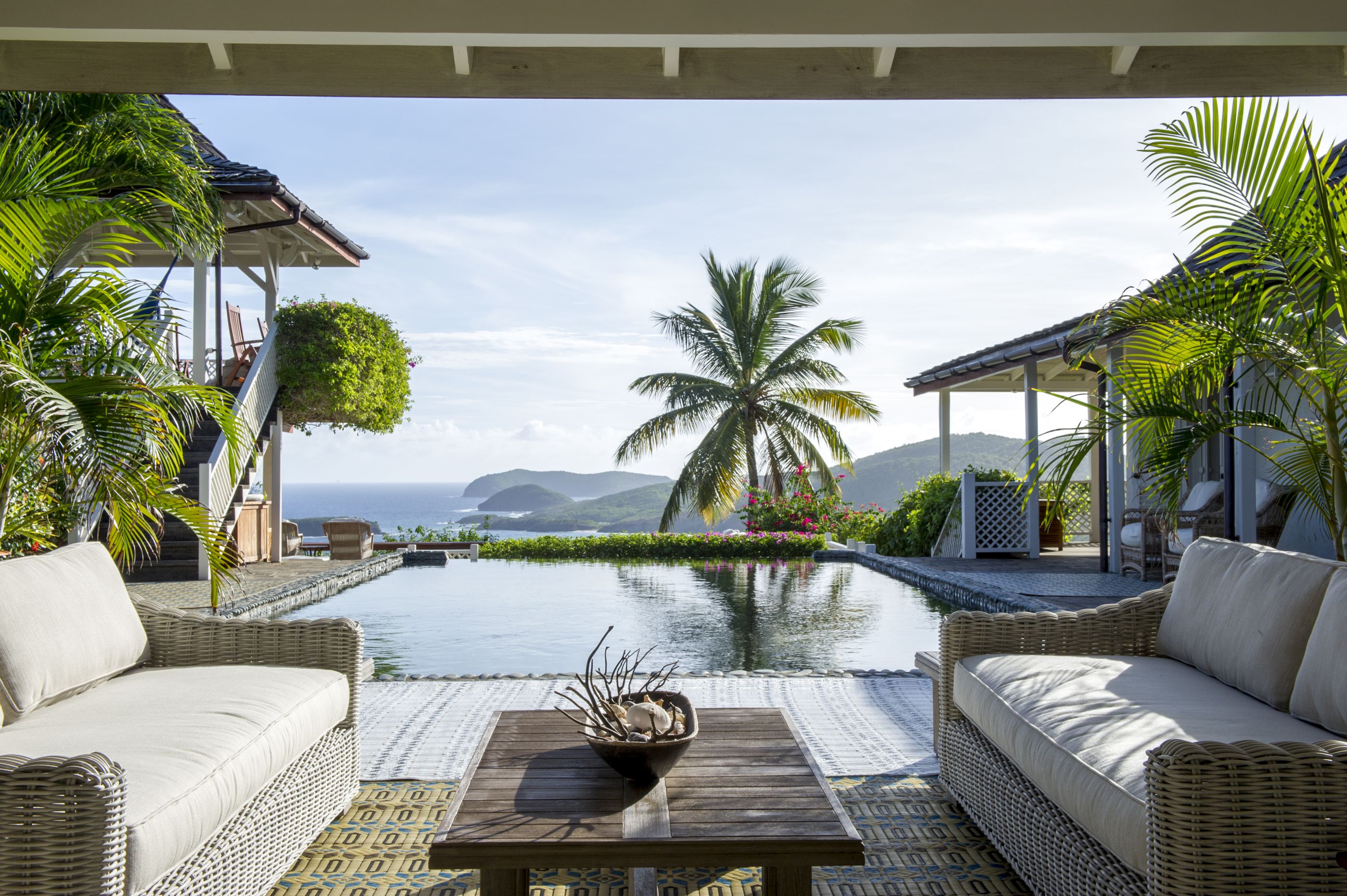 Outdoor living area overlooking the pool at luxury villa Pangolin in Mustique