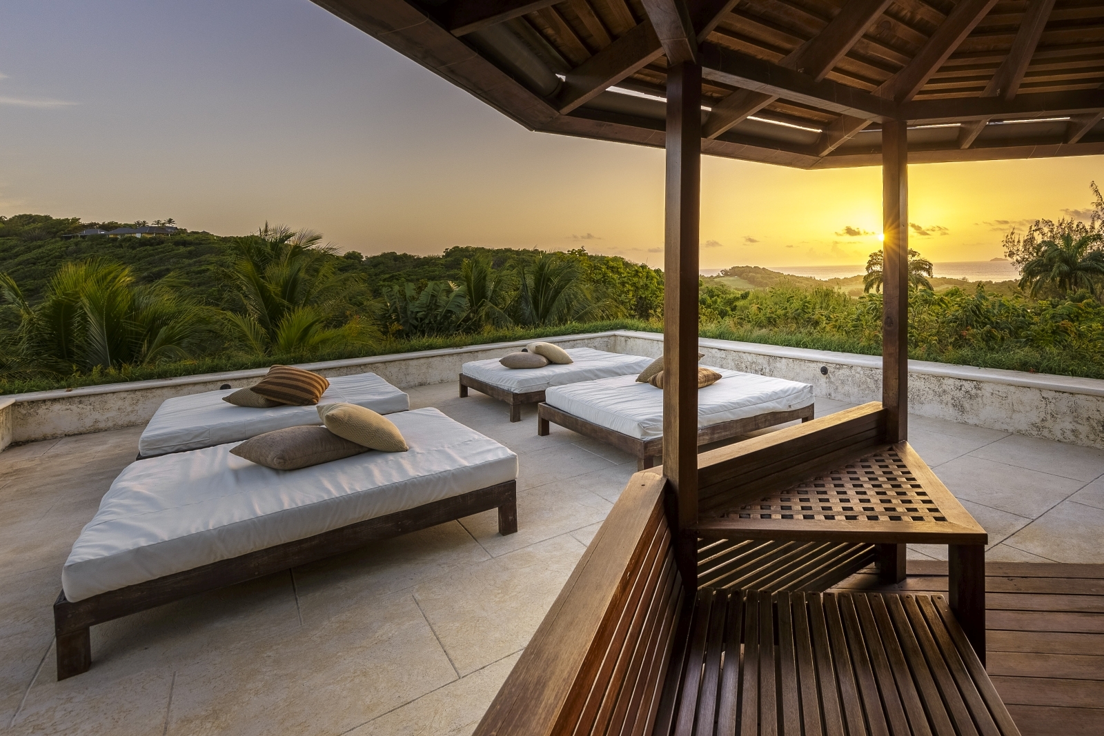 Sunset and outdoor relaxation area at Serenissima in Mustique