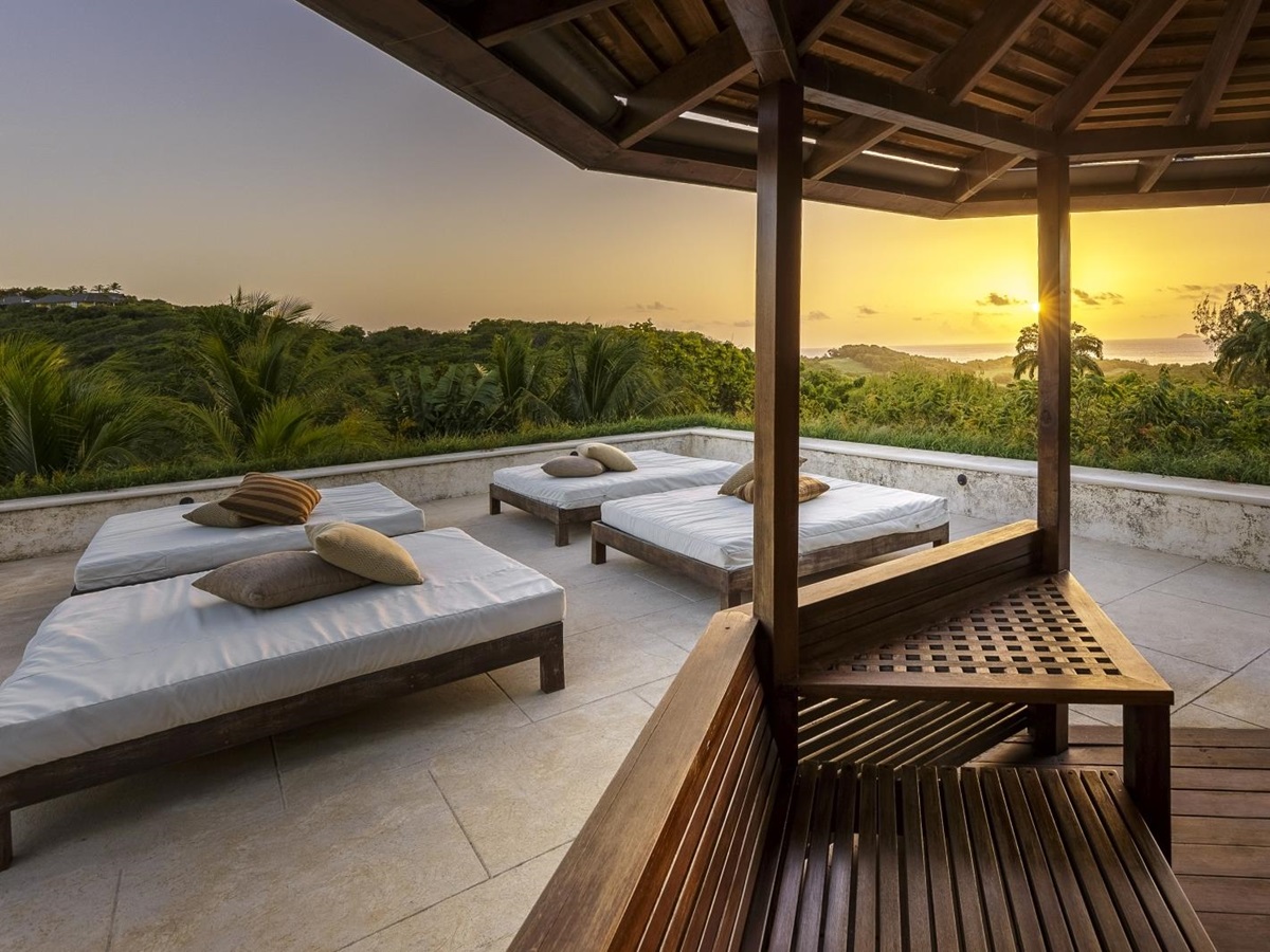 Sunset and outdoor relaxation area at Serenissima in Mustique