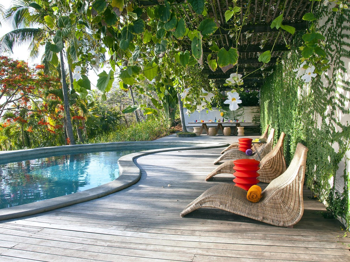 Sunbeds at the swimming pool of Villa America, Mustique