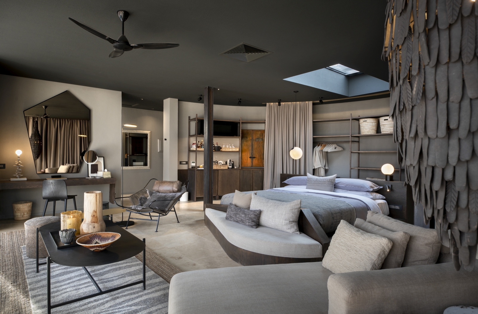Interior of a spacious guest suite with skylight above the bed for night-time stargazing
