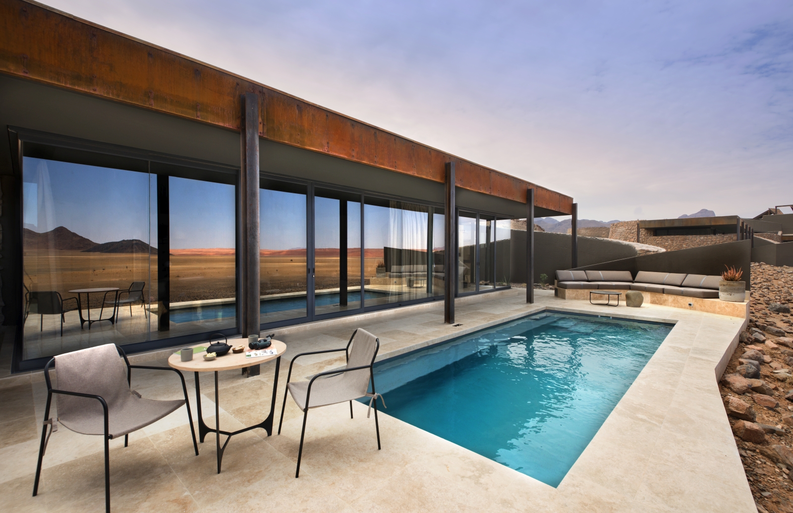 Private plunge pool with outdoor lounge area of a guuest suite