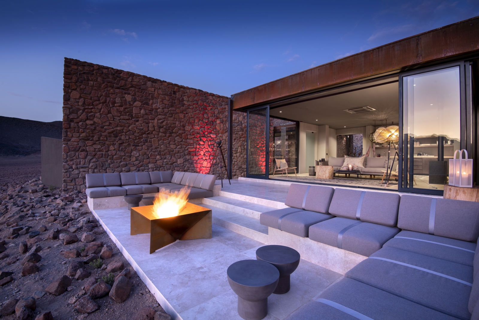 Outdoor lounge area of Star Dune Suite with bonfire