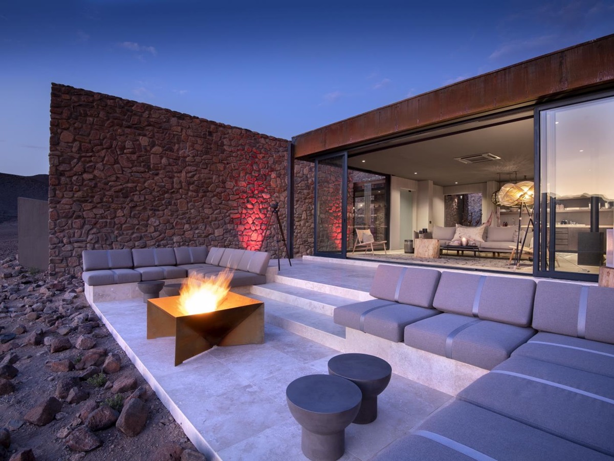 Outdoor lounge area of Star Dune Suite with bonfire