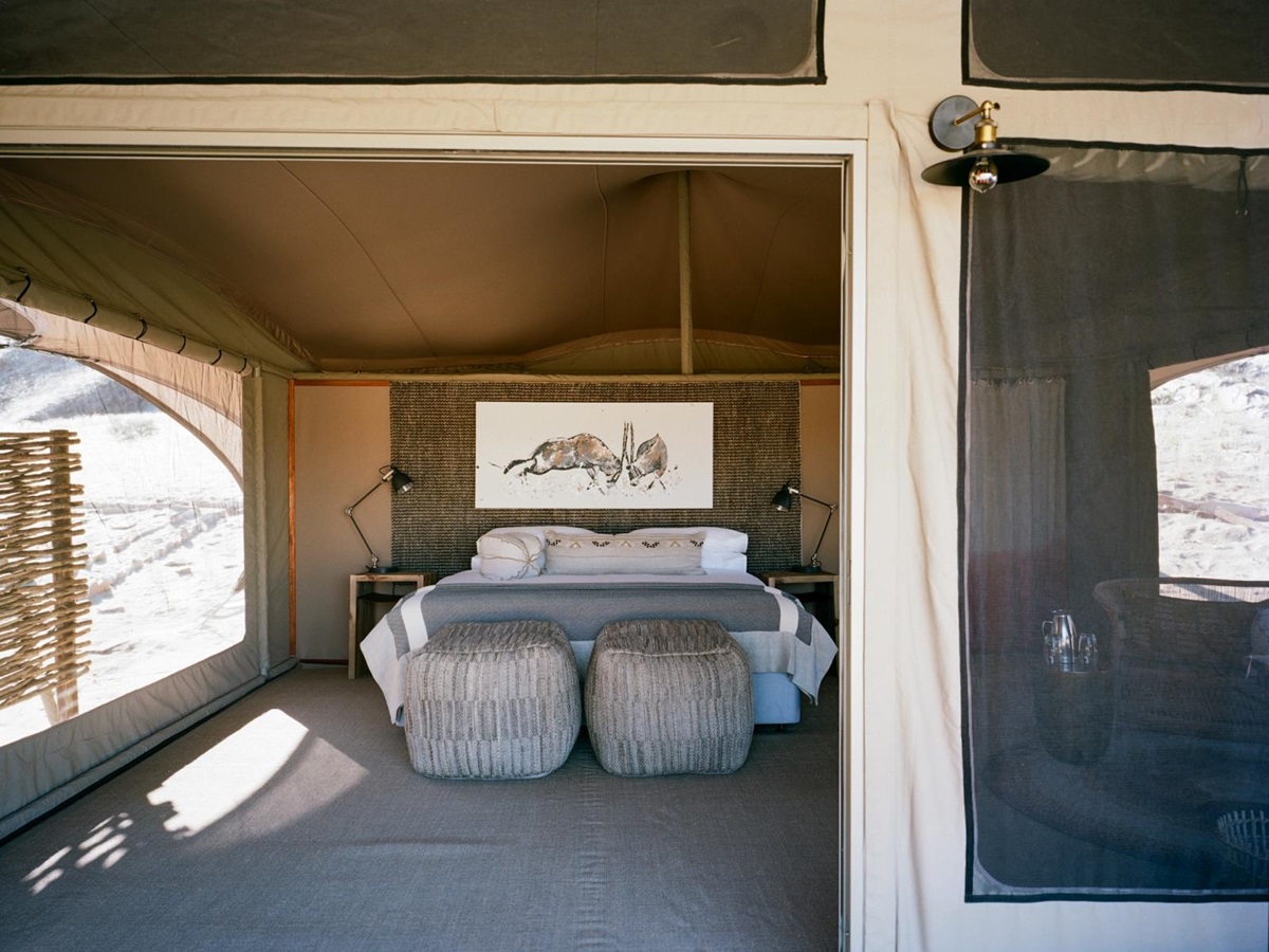 Tented bedroom with animal drawing over bed