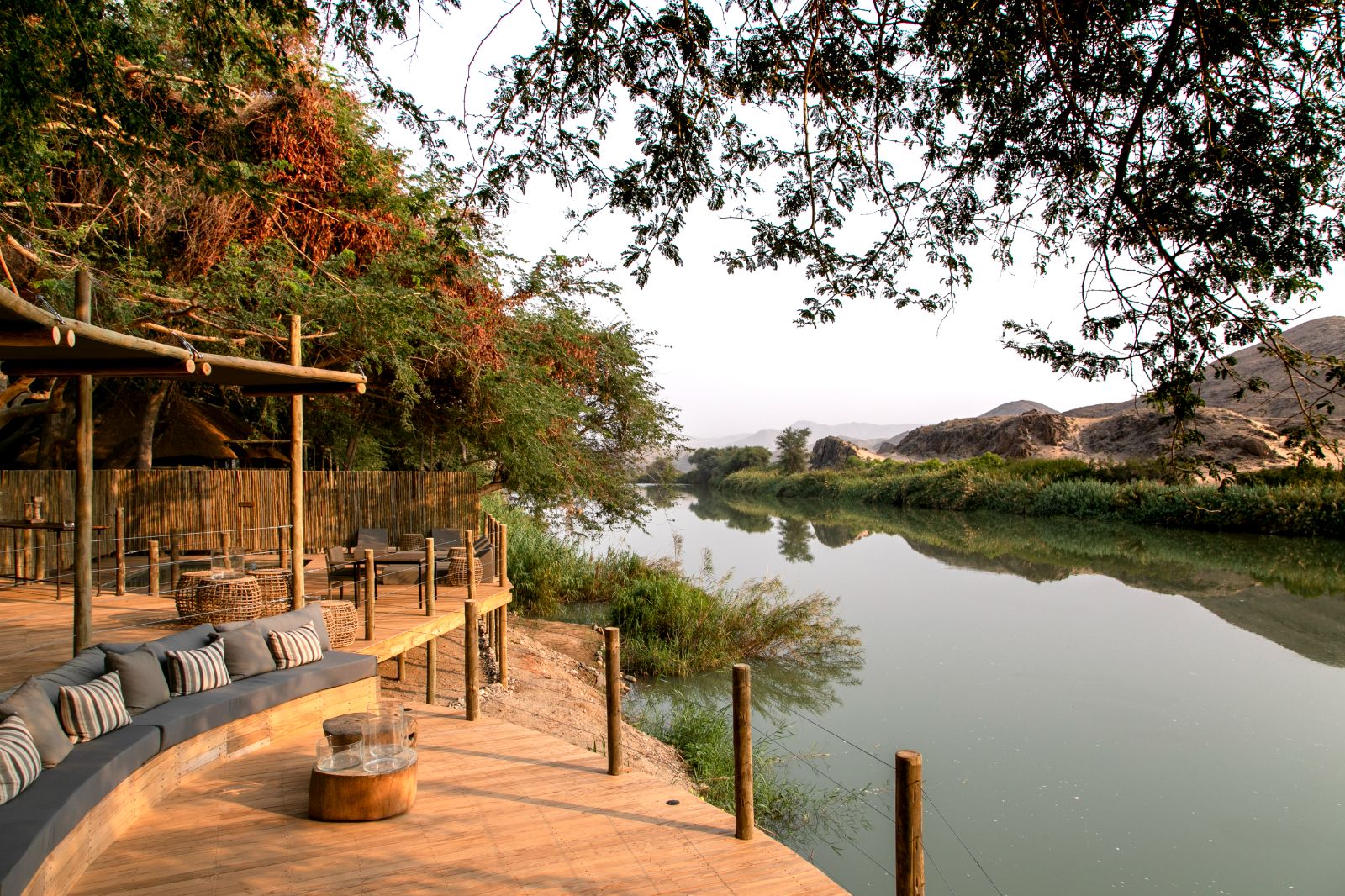 Seating area over the water on the deck of luxury lodge Serra Cafema in Kakaoland, Namibia