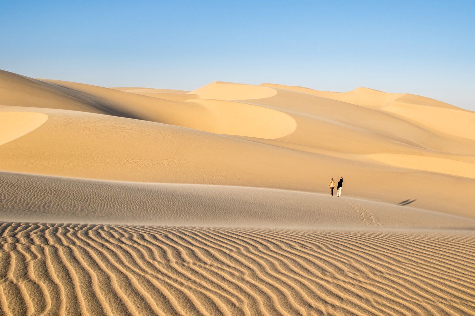 Guest exploring the desert during at stay at luxury lodge Shipwreck Lodge in the Skeleton Coast National Park, Namibia