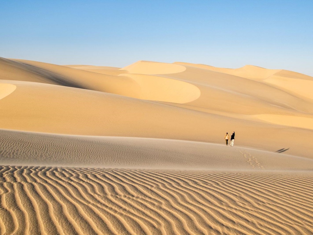 Guest exploring the desert during at stay at luxury lodge Shipwreck Lodge in the Skeleton Coast National Park, Namibia