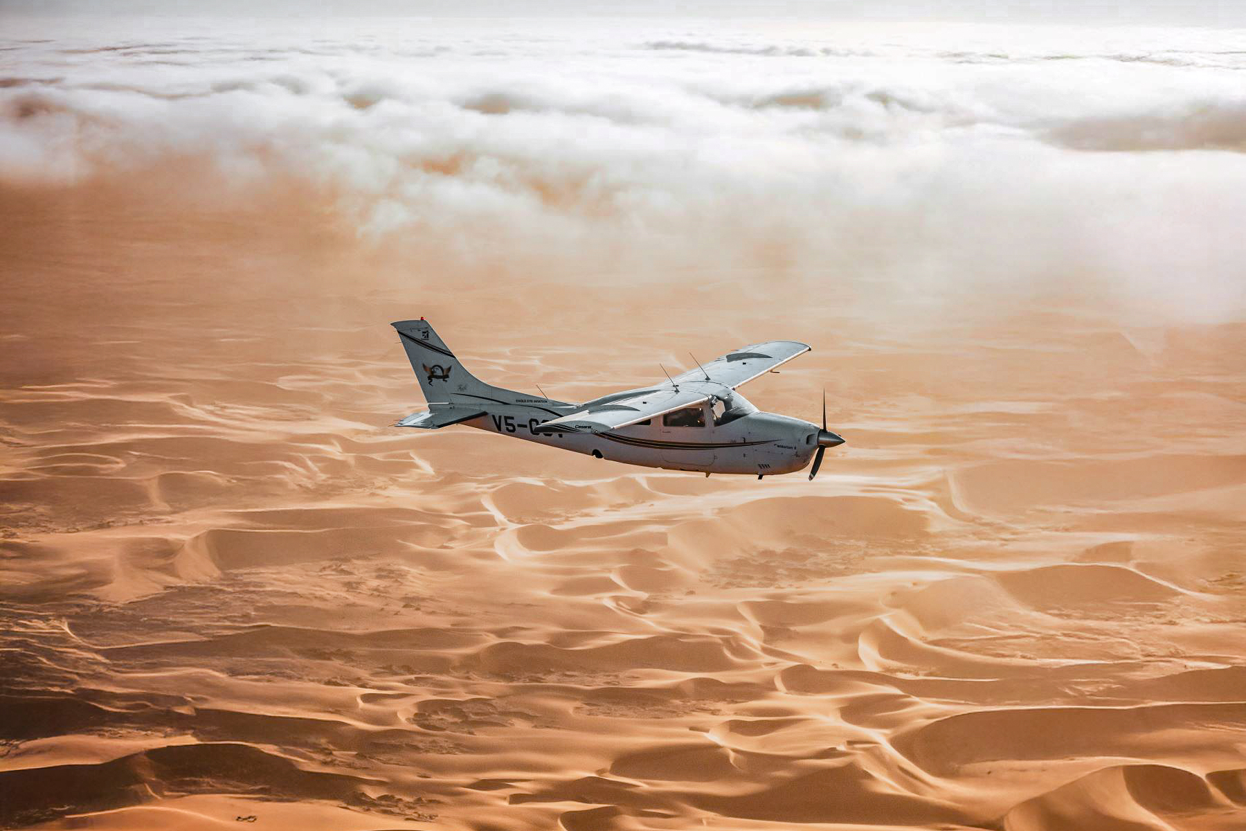 A plane flying over the Namibian desert