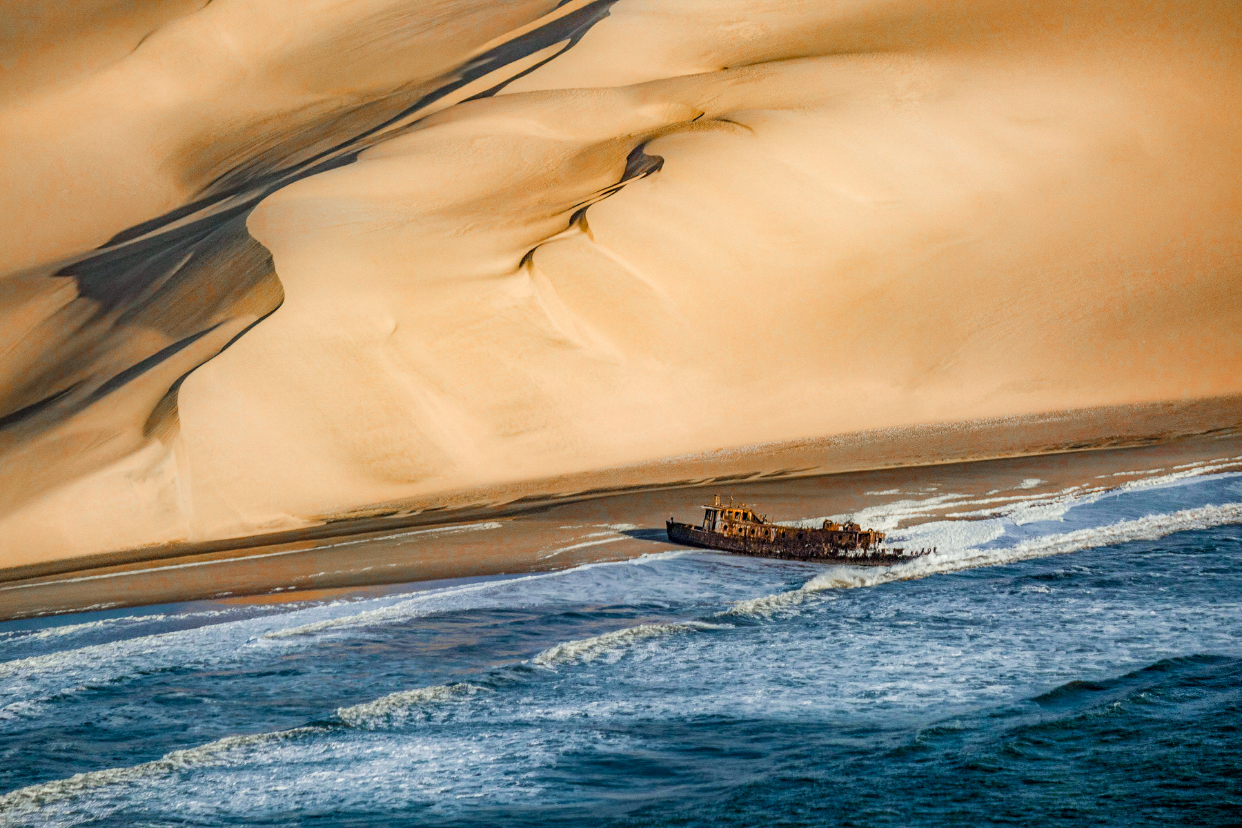 A shipwreck viewed from a plane over Namibia's Skeleton Coast