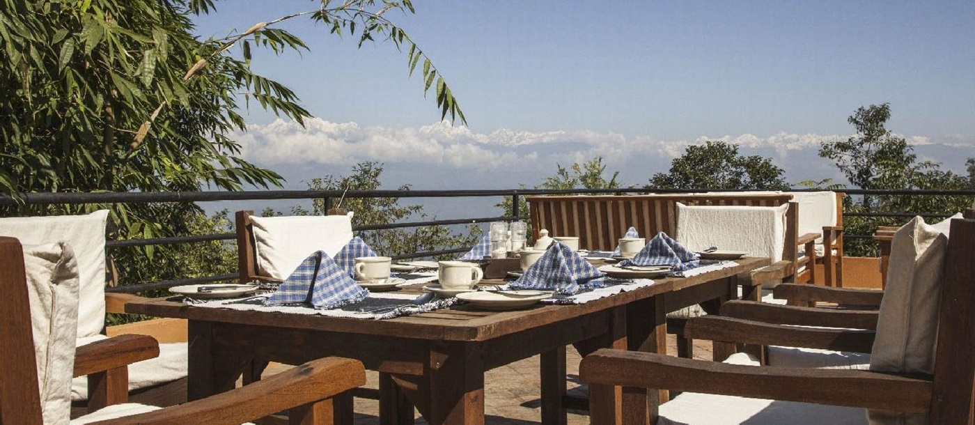 Outdoor dining with mountain views at Dwarika's Resort Dhulikhel Nepal