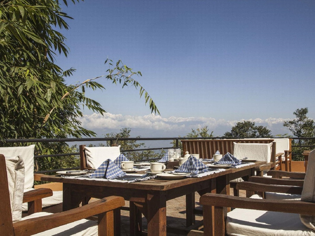 Outdoor dining with mountain views at Dwarika's Resort Dhulikhel Nepal