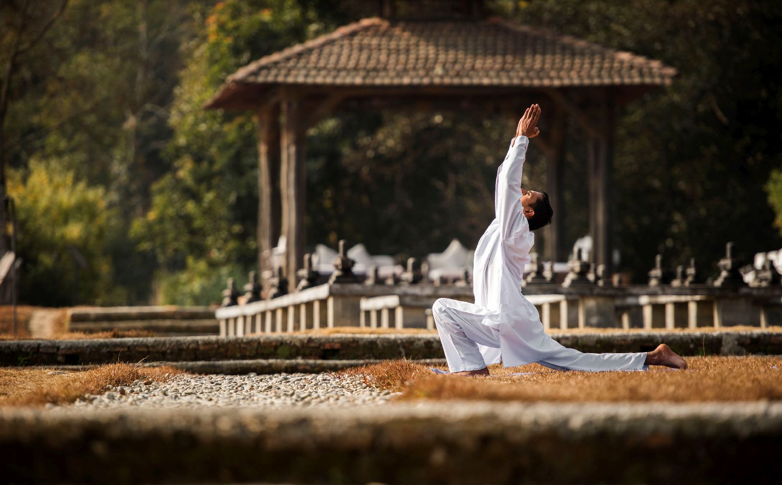 Yoga practice in the grounds of Dwarika's Resort Dhulikhel Nepal