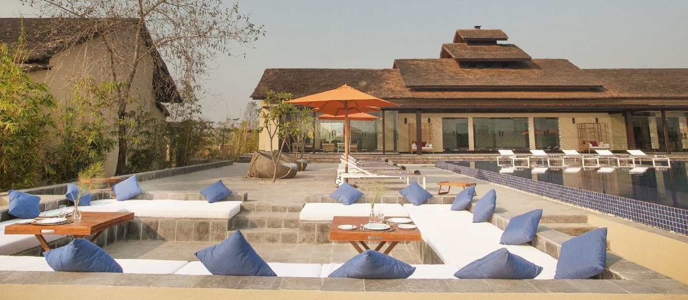 Pool and sun terrace at Meghauli Serai luxury safari camp Nepal